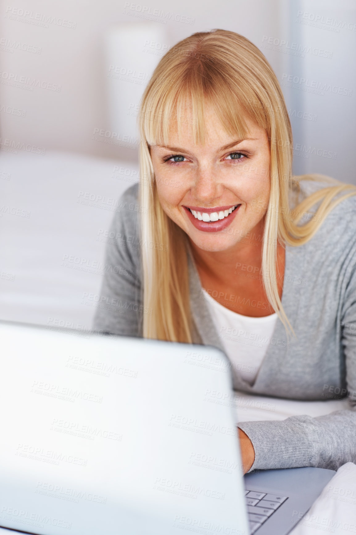 Buy stock photo Pretty young college student working on laptop and smiling