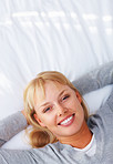 Woman relaxing on bed