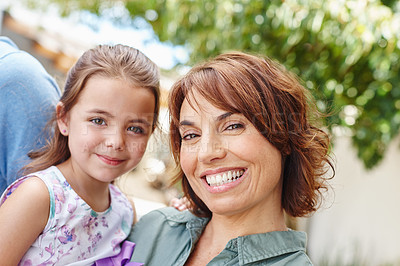 Buy stock photo Portrait of a mother and daughter standing outside