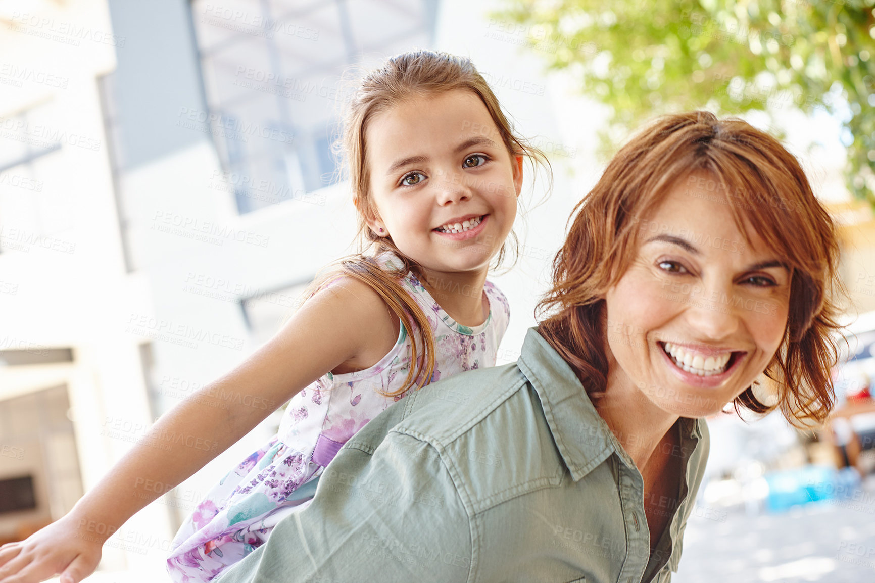 Buy stock photo Portrait, happy woman and child with piggyback in backyard of home, smile and support for connection. Security, mother and daughter outdoor together on weekend, trust and care for relationship