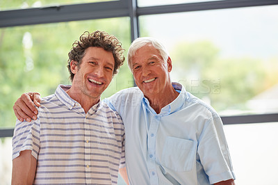Buy stock photo Portrait of a man and his father standing together indoors