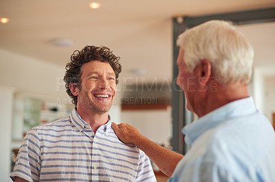 Buy stock photo Shot of a father resting his hand on his adult son's shoulder