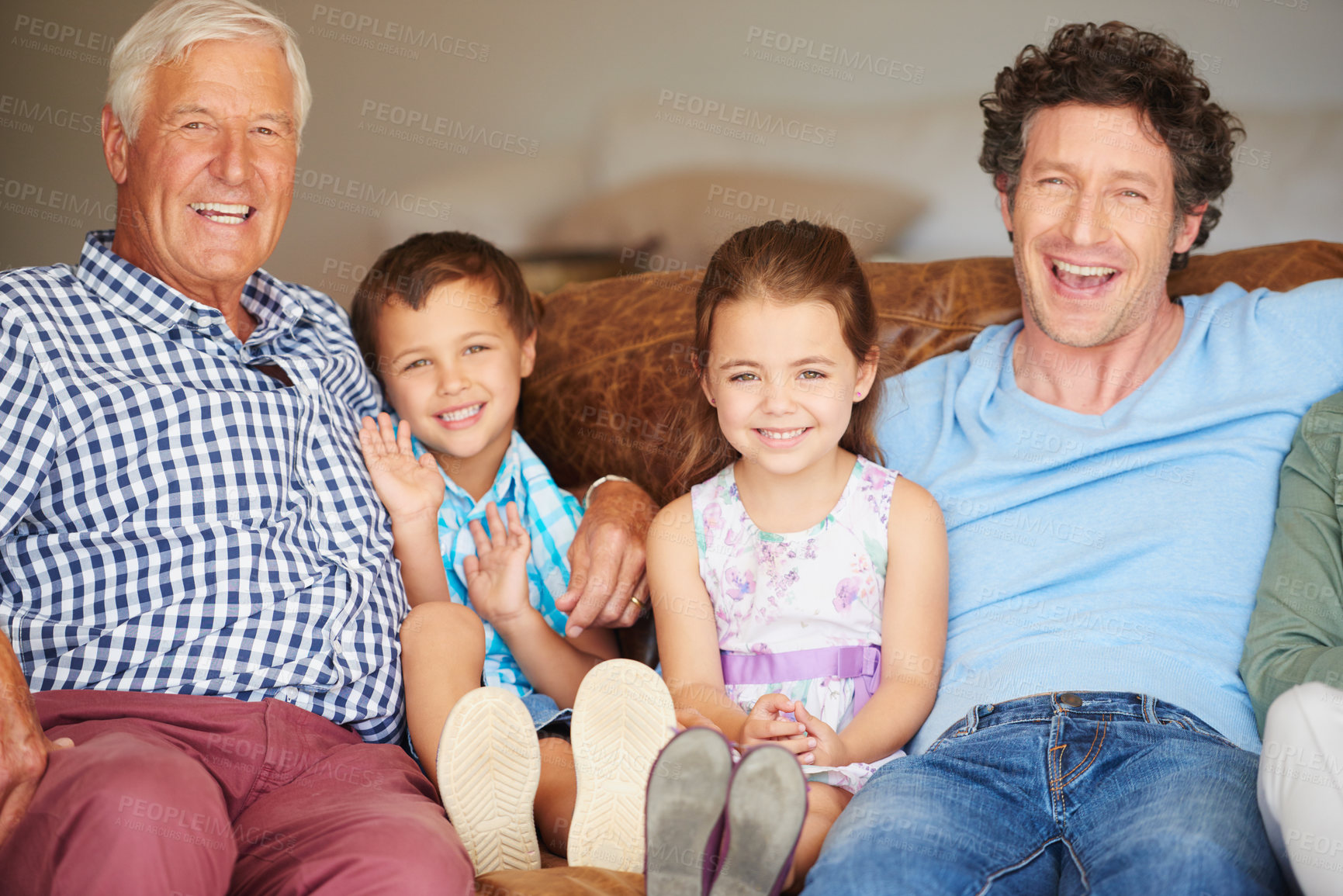 Buy stock photo Shot of two children sitting with their father and grandfather indoors