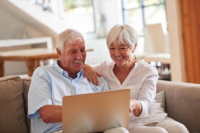 Buy stock photo Shot of a senior couple using a laptop together