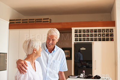 Buy stock photo Cropped shot of a senior couple in the kitchen