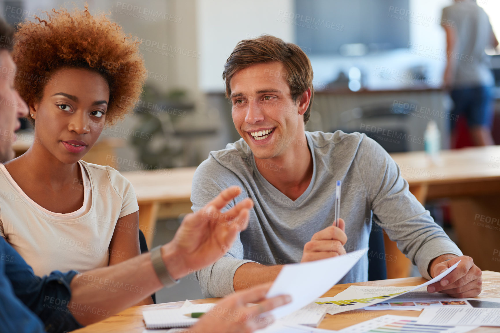 Buy stock photo Shot of a group of colleagues collaborating with each other on a project in an office