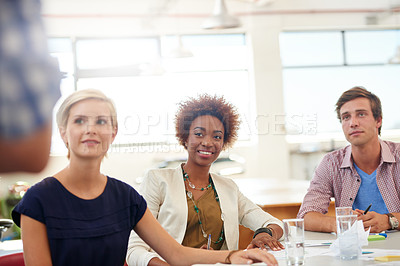Buy stock photo Shot of a team of young professionals in a business presentation