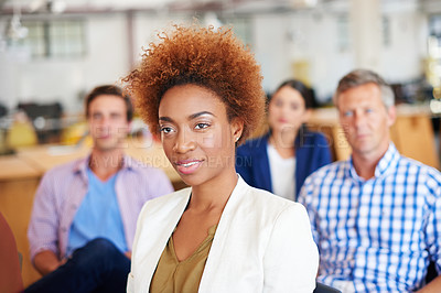 Buy stock photo A group of colleagues listening to a presentation