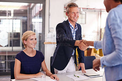 Buy stock photo Cropped shot of three businesspeople in an office