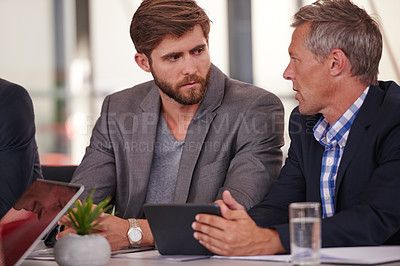 Buy stock photo Cropped shot of three businessmen in a meeting