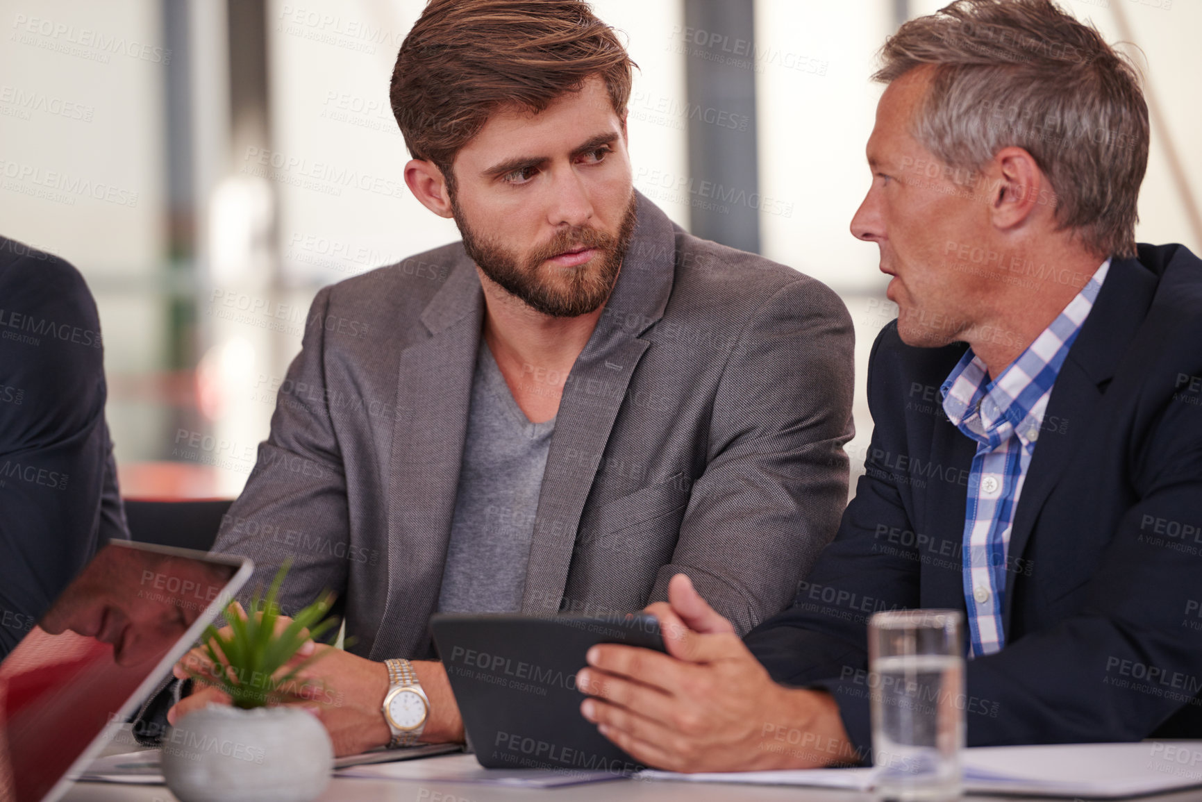 Buy stock photo Boardroom, meeting and men with tablet, discussion and planning for business development or teamwork. People, talking and collaboration with financial analyst for investment opportunity and corporate