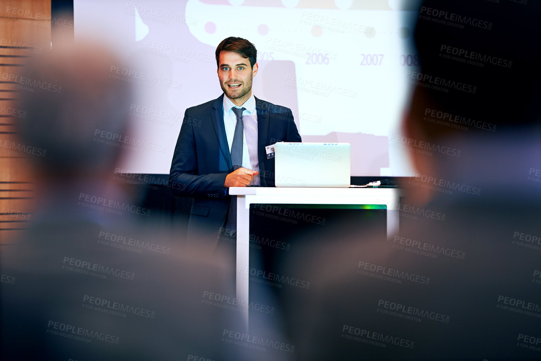 Buy stock photo Business man, podium and presentation with projector screen, conference or workshop with laptop for slideshow. Corporate training, seminar and speaker with info, audience and professional speech