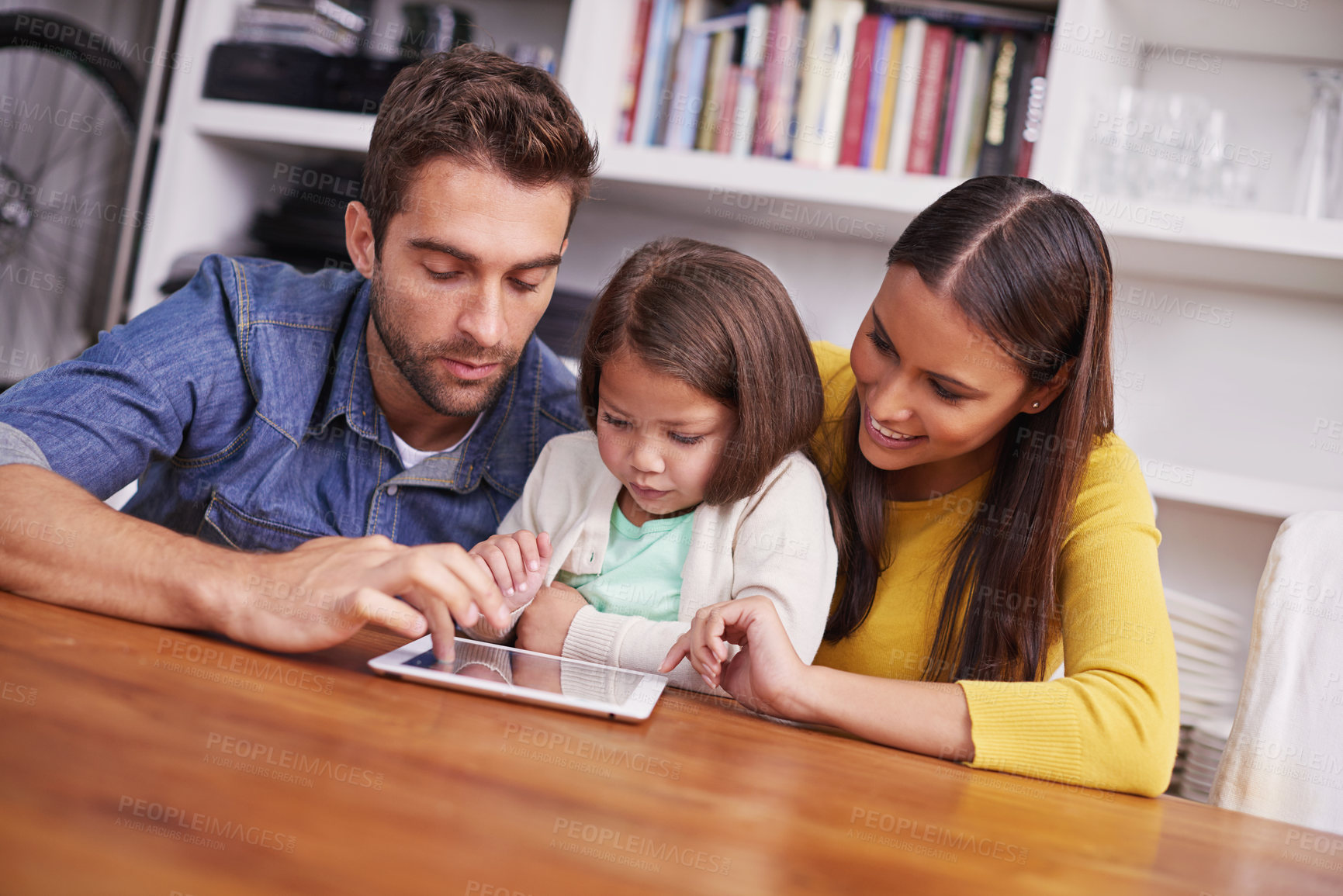 Buy stock photo Mom, dad and child in home with tablet for teaching, learning and support in education with love. Elearning, digital app and parents with girl for help in homeschool, growth and development online