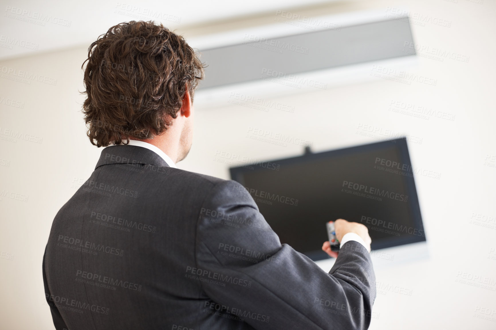 Buy stock photo Business man, remote and tv for presentation in office, switch program and channel or slide show. Male person, back and professional in workplace, change video and streaming at seminar or workshop
