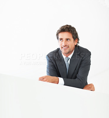 Buy stock photo Businessman, thinking and lean on wall with happy or smile with pride for company success. Vision, professional and bright future in industry with thoughts, experienced and financial manager.