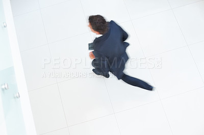 Buy stock photo Top view of business man running with suitcase