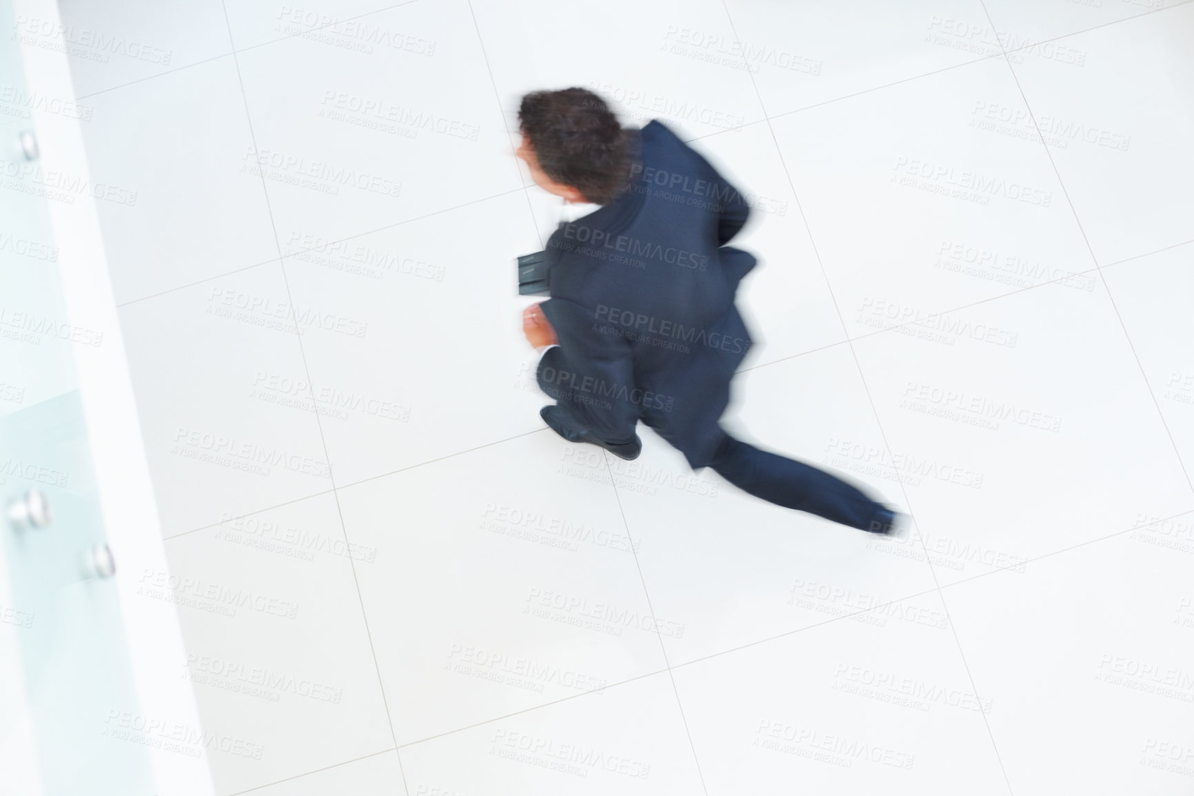 Buy stock photo Office, work and floor with motion blur of businessman for legal, career and running late to job. High angle, corporate and attorney with speed in movement for schedule, deadline and rush in lobby