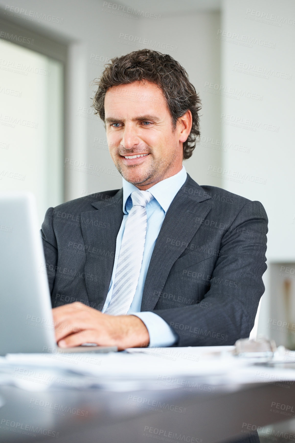 Buy stock photo Laptop, typing and businessman in office for planning schedule, internet connection and update website for law firm. Computer, smile and corporate lawyer by desk with research for legal case or info