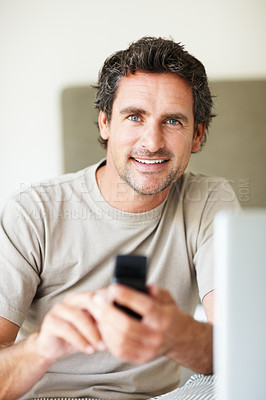 Buy stock photo Cellphone, bedroom and portrait of man with smile in home for text message, contact and online chat. Happy, relax and person with mobile phone for communication, networking and connection in house