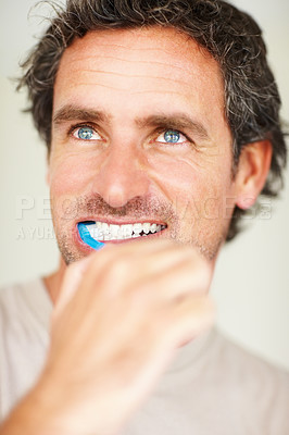 Buy stock photo Dental, man and face with smile or toothbrush for morning routine, hygiene and healthy mouth. Mature, person and thinking or happy with brush for cleaning, washing and oral health with confidence