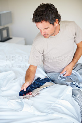 Buy stock photo Tie, dressing and business man with choice in home getting ready for work, career and job. Corporate, morning routine and happy worker prepare with trendy, professional fashion and formal style