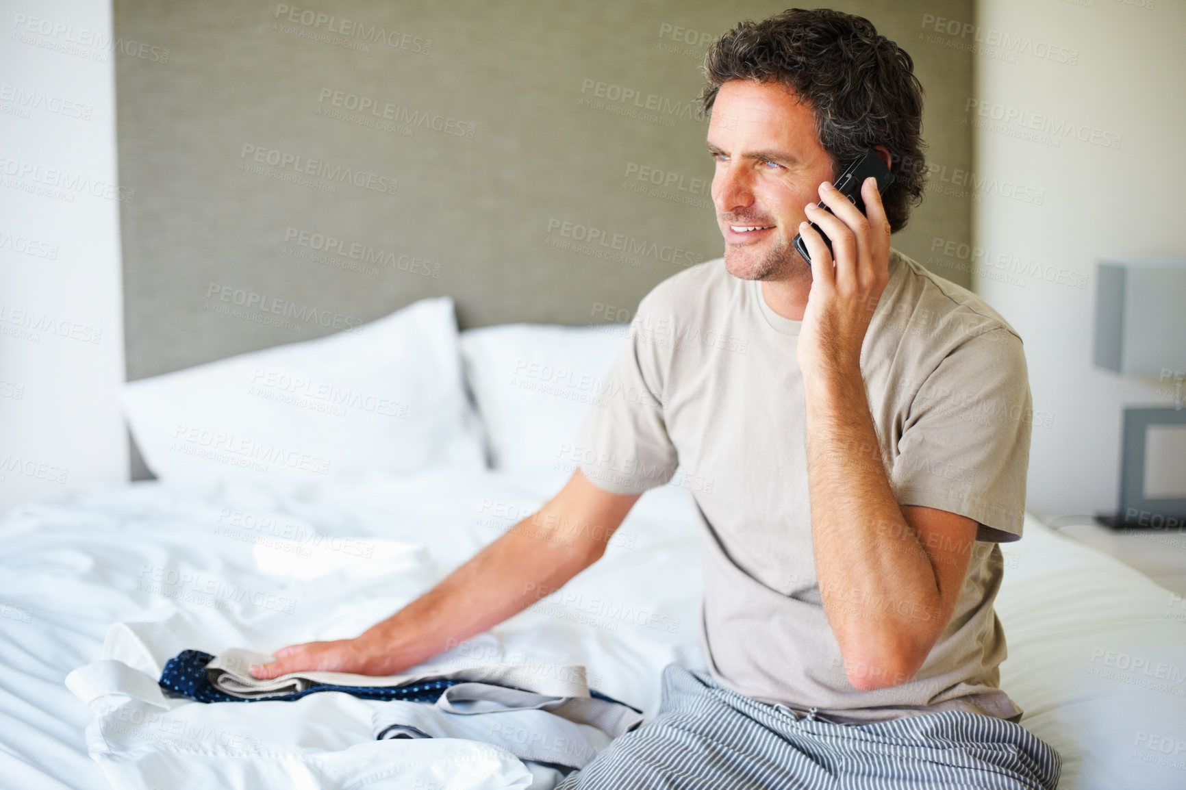 Buy stock photo Phone call, home and business man with clothes in bedroom getting ready for work, job and career. Technology, communication and happy person with tie on cellphone for conversation, chat and contact