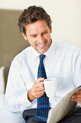 Buy stock photo Businessman, face and happy with coffee or newspaper in bedroom of home for morning routine and news. Entrepreneur, person and reading with article, cappuccino or espresso for story and information