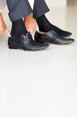 Buy stock photo Shoes, dressing and hands of business man in home getting ready for work, career and job. Corporate, morning routine and feet of worker prepare with trendy, professional fashion and formal style
