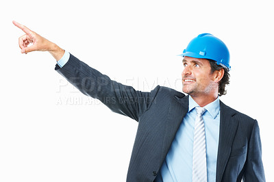 Buy stock photo Architecture, pointing and man in studio with project management, inspection or real estate planning. Happy manager or engineering expert with presentation of design or building on a white background