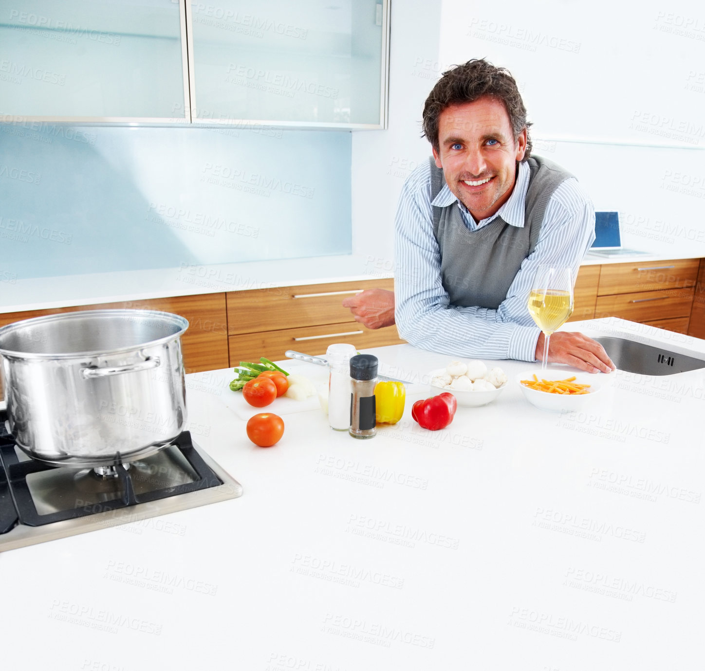 Buy stock photo Portrait of a handsome mature man standing in the kitchen
