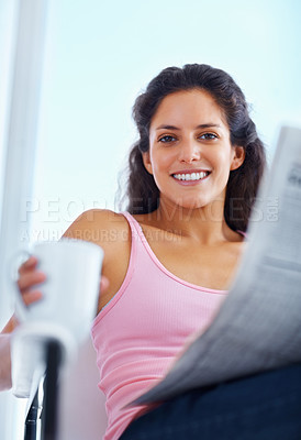 Buy stock photo Portrait, smile and woman drinking coffee with newspaper in home, espresso or latte for breakfast to relax in living room in the morning. Face, tea cup and person reading news or info in apartment