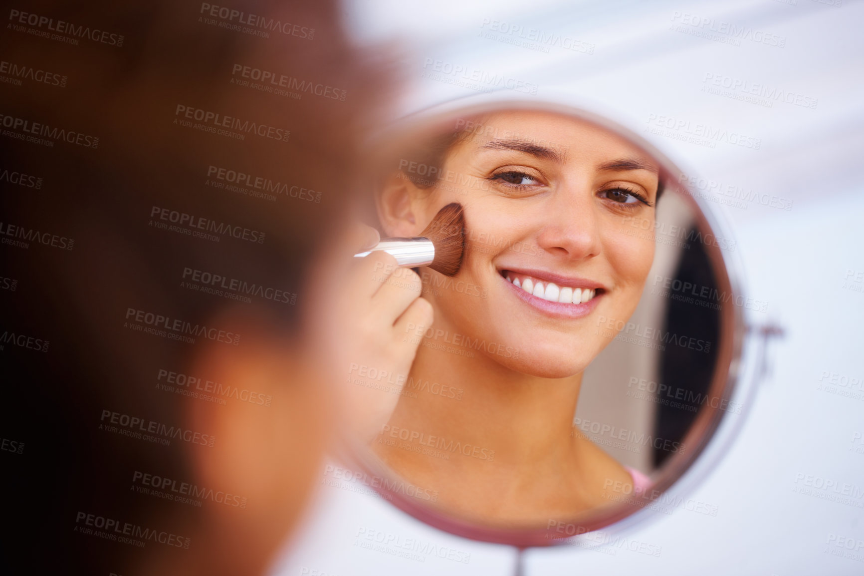 Buy stock photo Woman, face and makeup brush with mirror for beauty, cosmetics and facial skincare with happy in home. Person, smile and glow application with product and hand for wellness, cosmetology and aesthetic