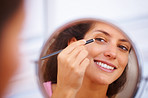 Woman applying eyeliner