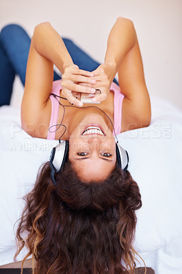 Buy stock photo Happy woman, portrait and bed with headphones for music, relax or listening to podcast at home. Female person smile and lying with headset for audio streaming, sound or playing song album in bedroom