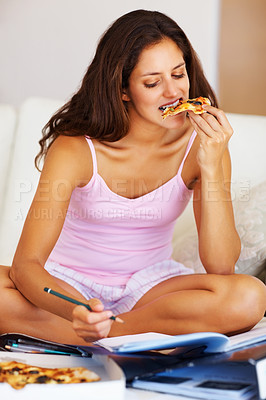 Buy stock photo Studying, eating and woman on bed with pizza for dinner, lunch or supper reading documents. Paperwork, textbook and young female student enjoying fast food and preparing for test, exam or assignment.