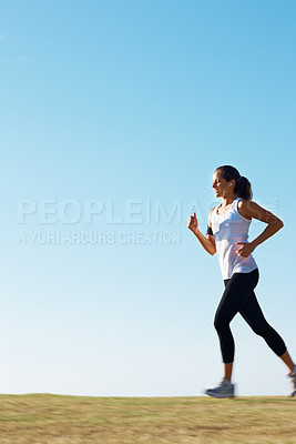 Buy stock photo Woman running, fitness and blue sky mockup for training, workout and body wellness in nature and listening to music. Young runner or person with energy, exercise and sports health in summer and park