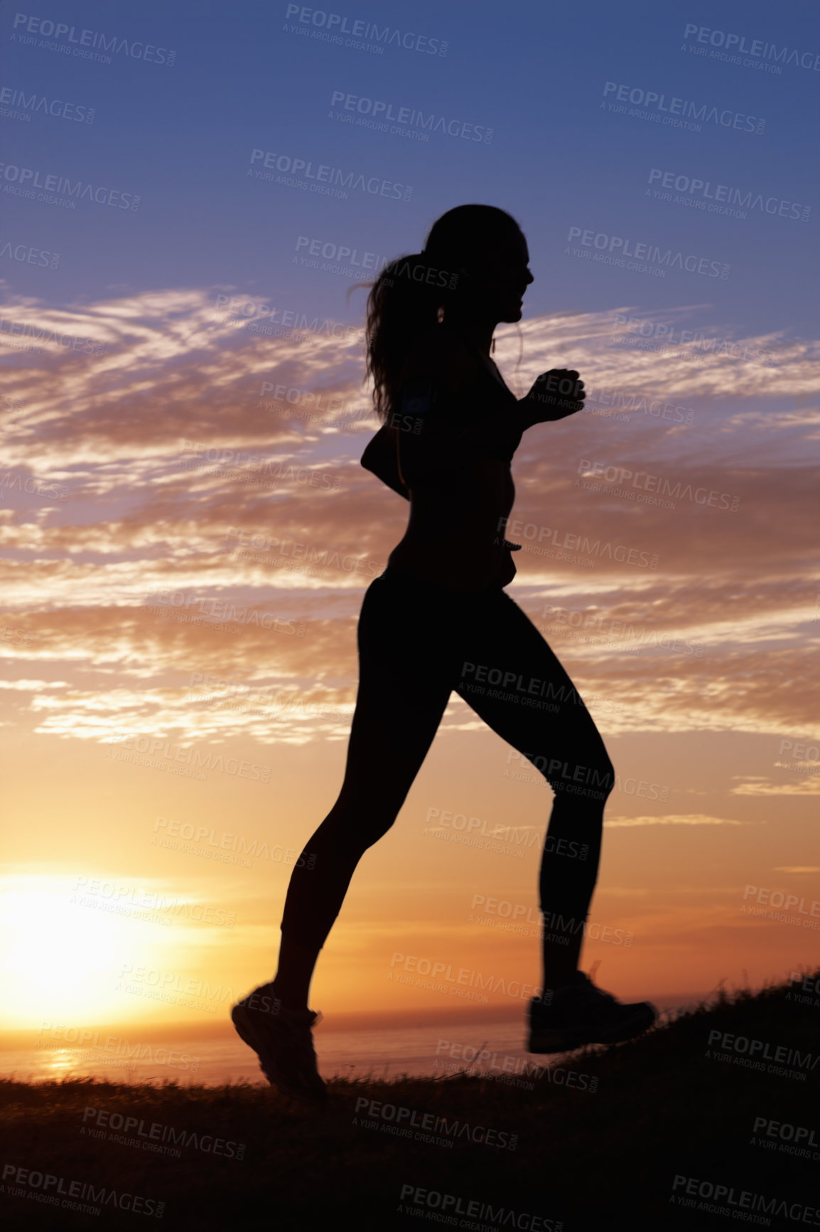 Buy stock photo Woman running, fitness on beach and sunset for workout, outdoor training and body health in shadow or a silhouette. Sports person, athlete or runner with exercise by ocean, nature or cardio on a hill