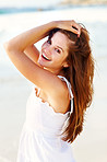 Pretty young female posing on beach