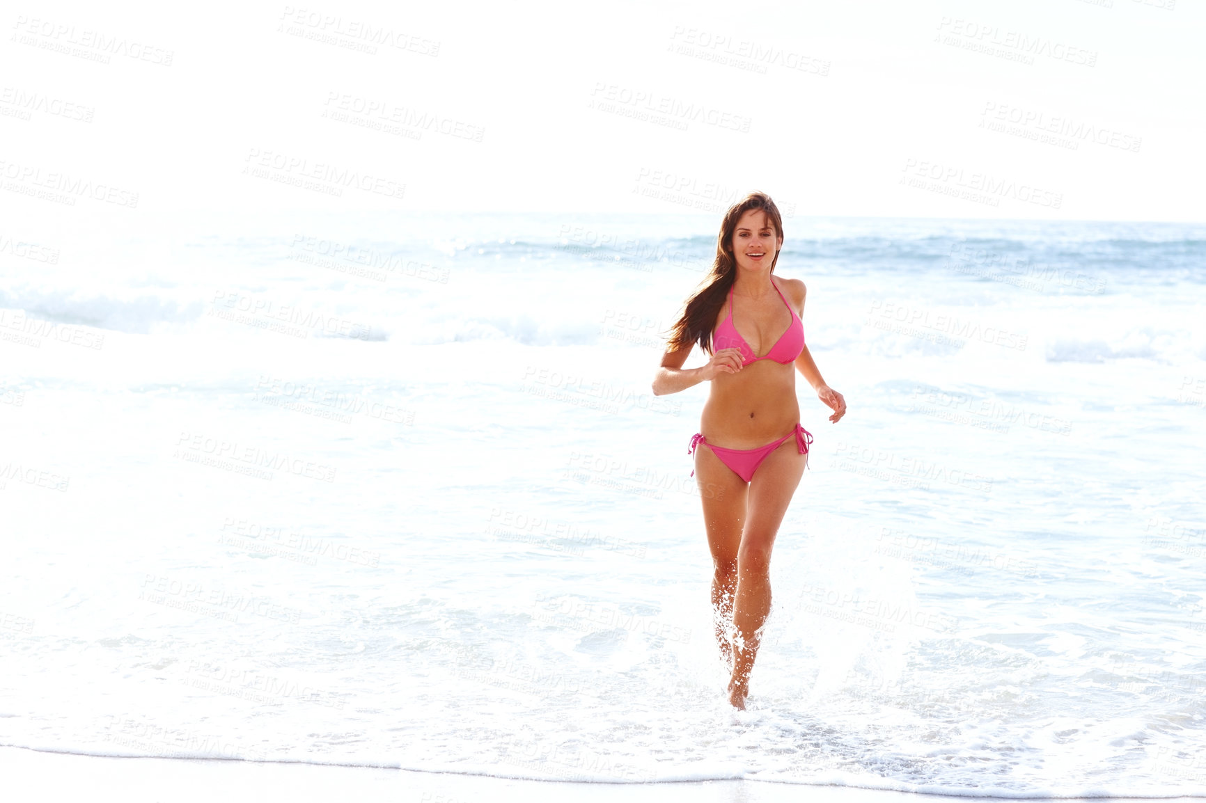 Buy stock photo Waves, running and happy woman in bikini on beach for summer vacation, travel and tropical island. Relax, playing and girl with smile at ocean for holiday with water, sunshine and energy in Hawaii.