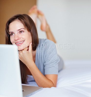 Buy stock photo Relax, laptop and happy woman on bed thinking, social media post or online chat website in home. Computer, morning and girl with smile, networking idea or internet search for communication in bedroom