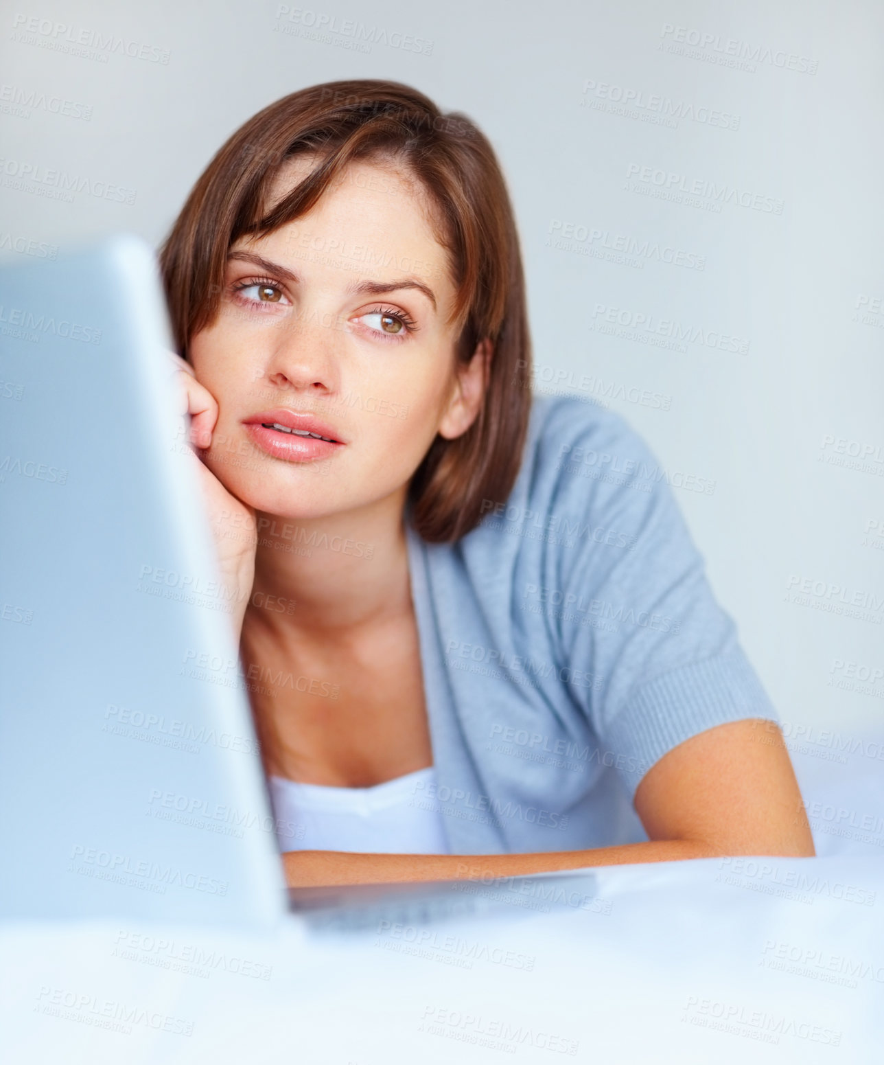 Buy stock photo Laptop, thinking and serious woman on bed in home, remote work or inspiration on internet. Computer, freelance and business idea in bedroom, decision and problem solving, choice or question solution