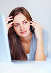 Woman having a serious conversation over cellphone on bed