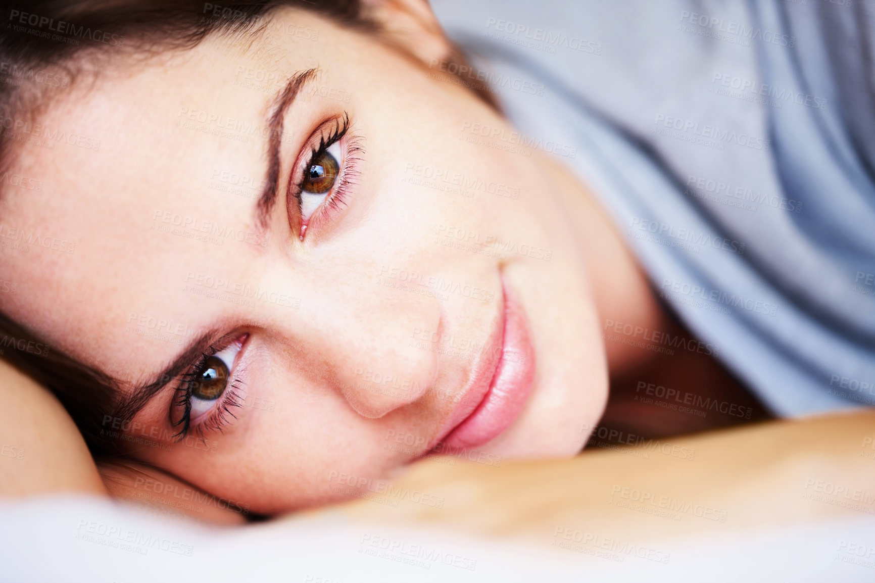 Buy stock photo Rest, closeup and portrait of woman on bed for sleeping, dreaming and comfortable at home. Smile, morning and face of tired person in bedroom relaxing, nap and wake up for health, wellness and calm