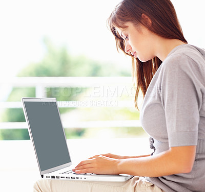 Buy stock photo Laptop, typing and serious woman in home, remote work or social media on internet. Computer, freelance and businesswoman in house, reading email and communication on tech, research project and info