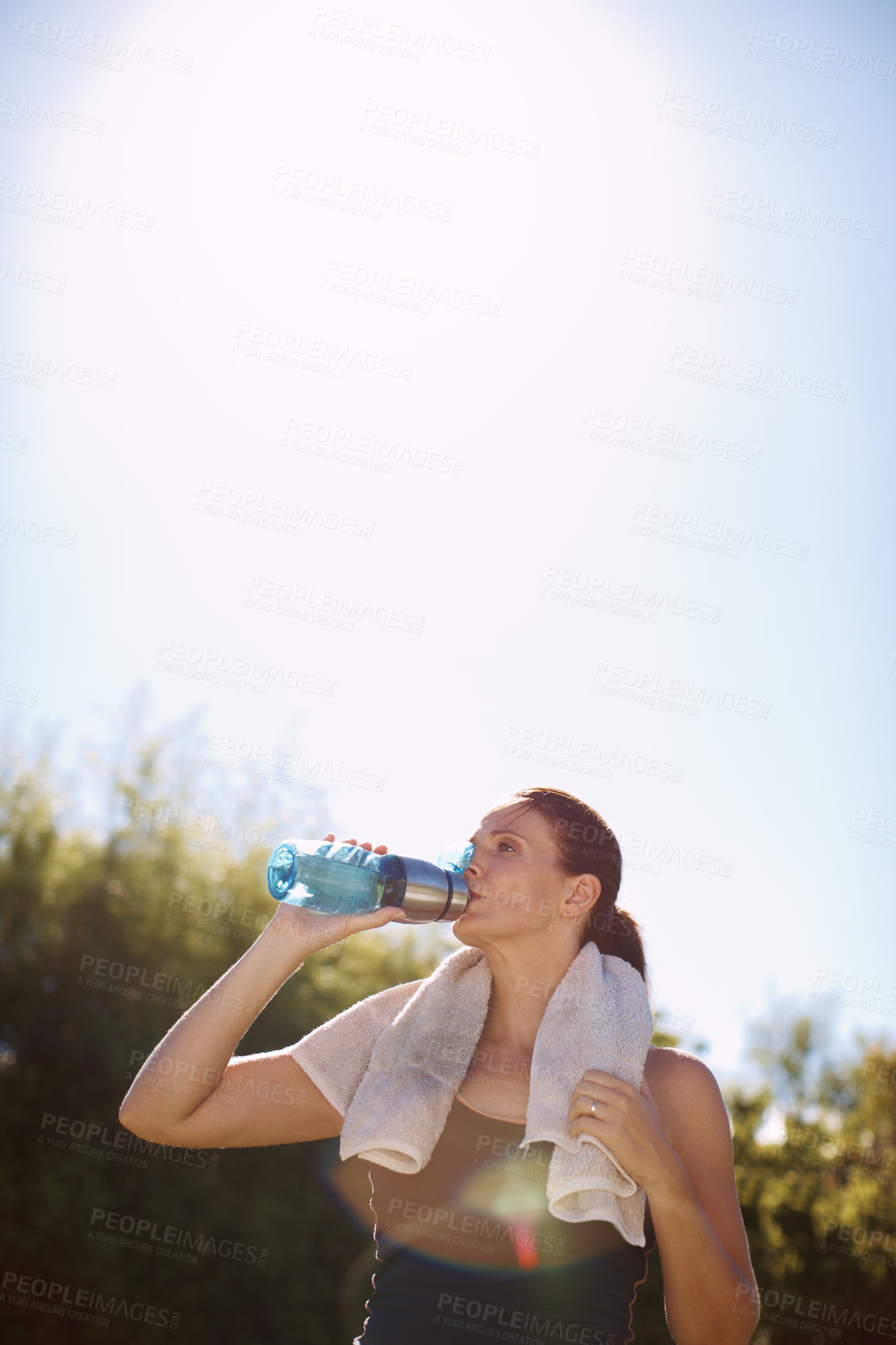 Buy stock photo Mature, woman and fitness or drinking water outside in nature, hydration and health or outdoor workout goal. Sport, wellness athlete and training in summer for female person, runner and park or break