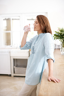 Buy stock photo House, kitchen and woman with drinking water in glass for hydration, minerals and liquid nutrition. Female person, relax and thirsty with aqua at home for healthy diet, body care and h2o wellness