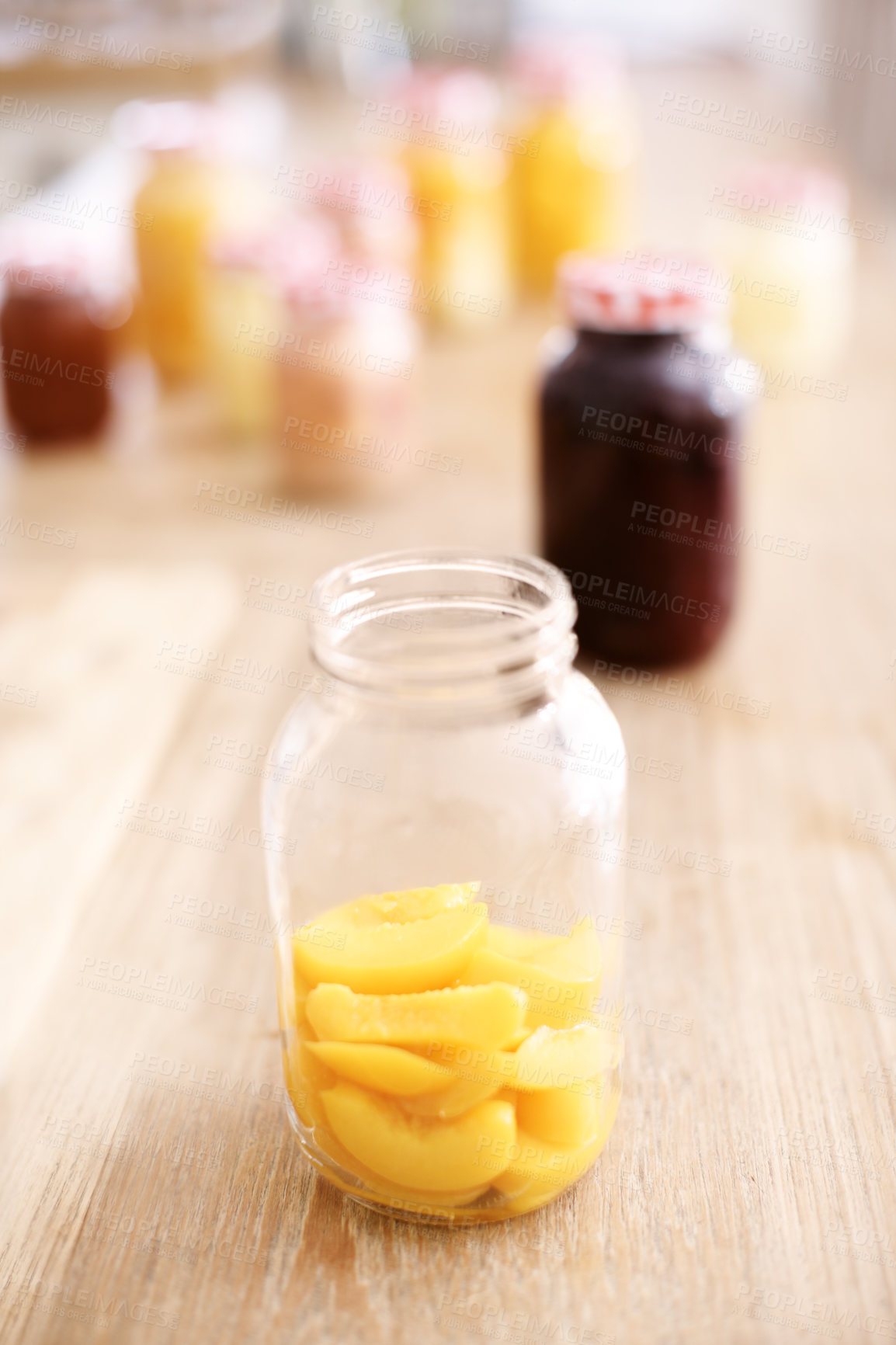 Buy stock photo Open, jar and peach on table, kitchen and fruit for nutrition, healthy and glass on wood and protein. Home, countertop and preserved for diet, vitamin c and breakfast in morning, snack and food