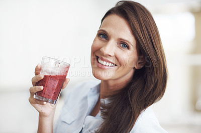 Buy stock photo Closeup shot of an attractive woman enjoying a fruit smoothie