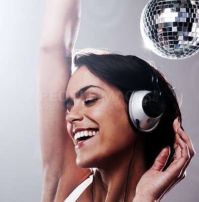 Buy stock photo Closeup, happy woman and headphones for dancing in studio on white background for disco music mock up. Female model, eyes closed and energy for movement, mobility or health in wellness with smile