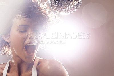 Buy stock photo Woman, disco ball and dancing for party in studio on brown background, lens flare and music mockup in closeup. Female model, eyes closed and singing for song with energy, power and confidence on face